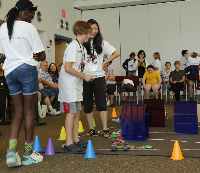 students playing with robots