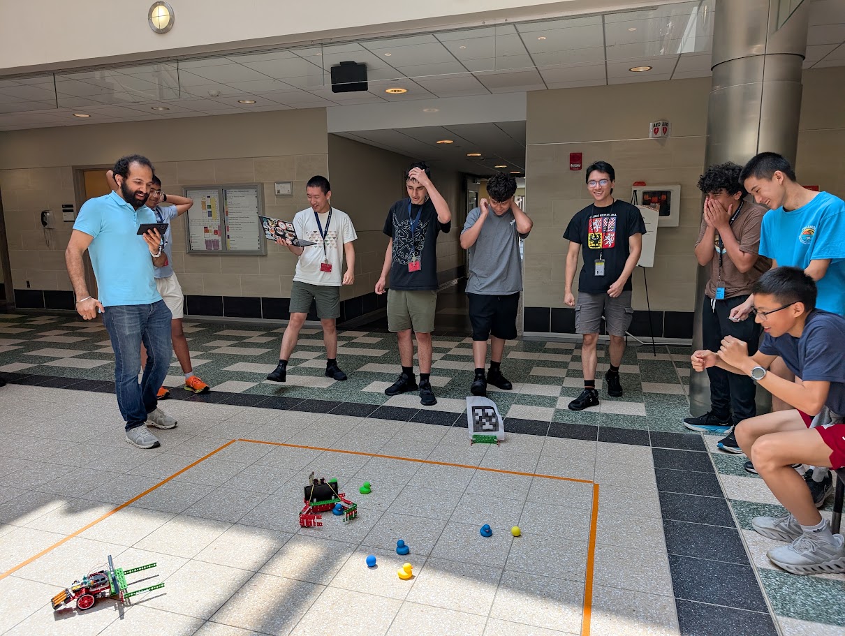 students playing with robots