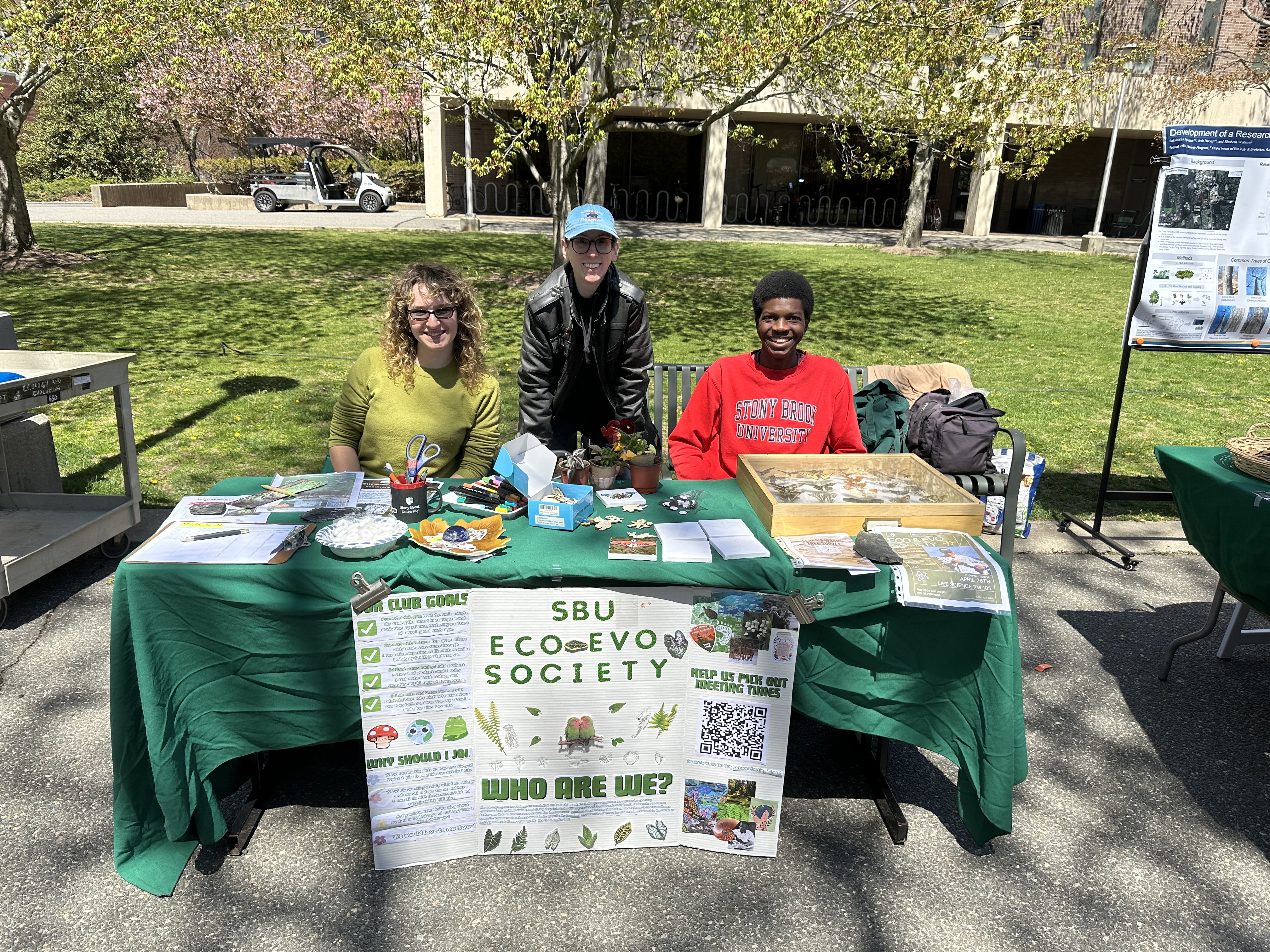 three students tabling for the club