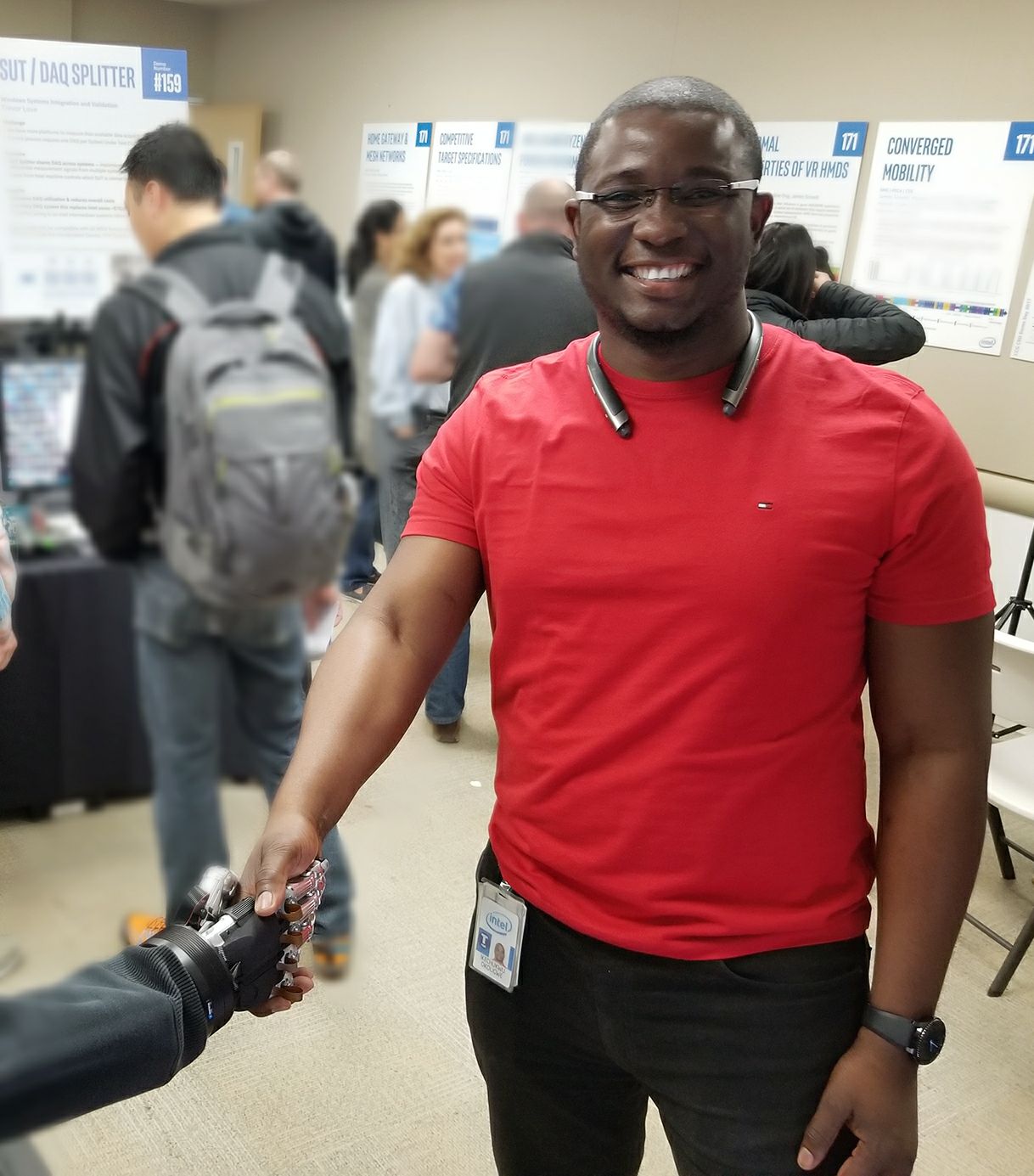 Aike shaking hands with a robot arm