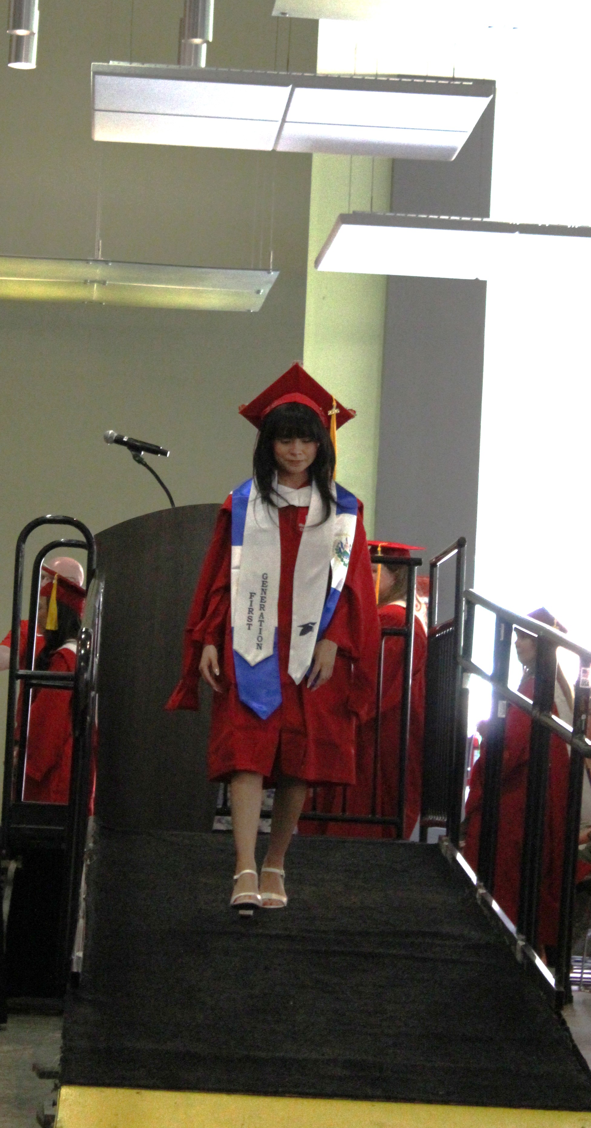 MA Student Walking at Graduation