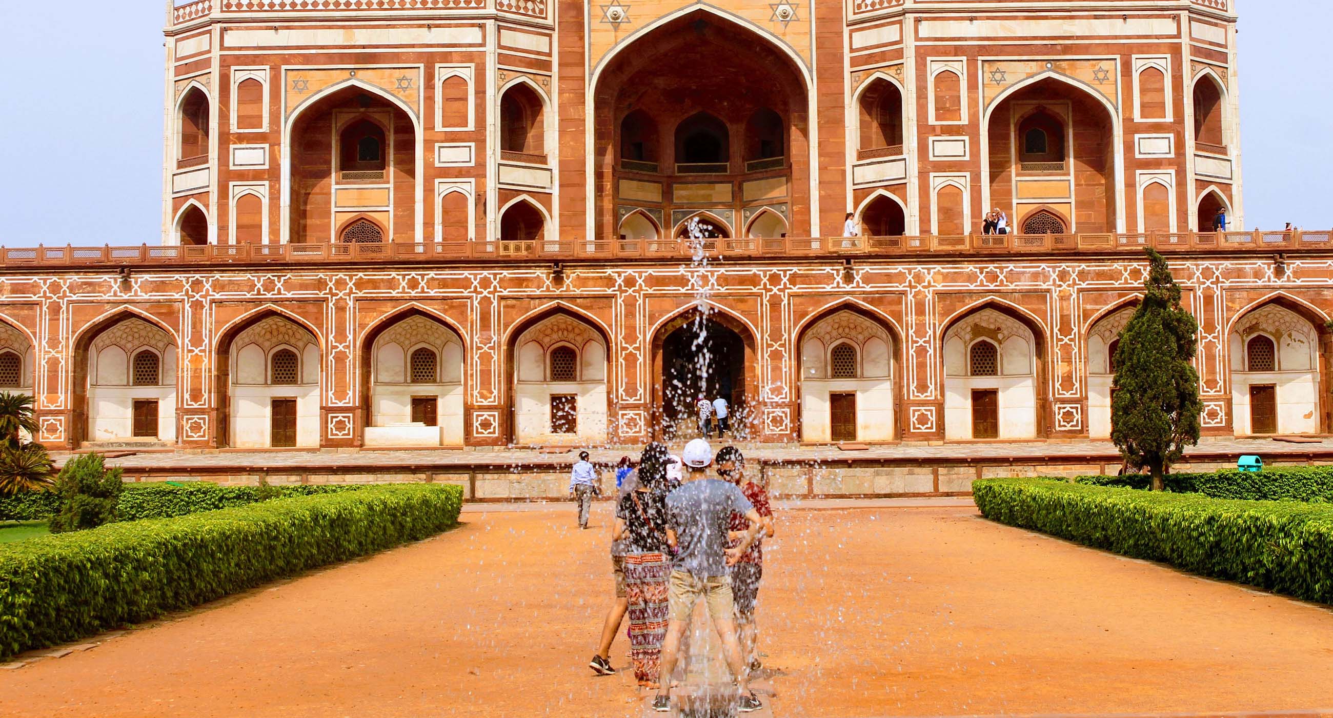 Visitors walking toward Humayun’s Tomb in Delhi, India