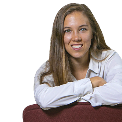 Student Smiling Leaning over Chair