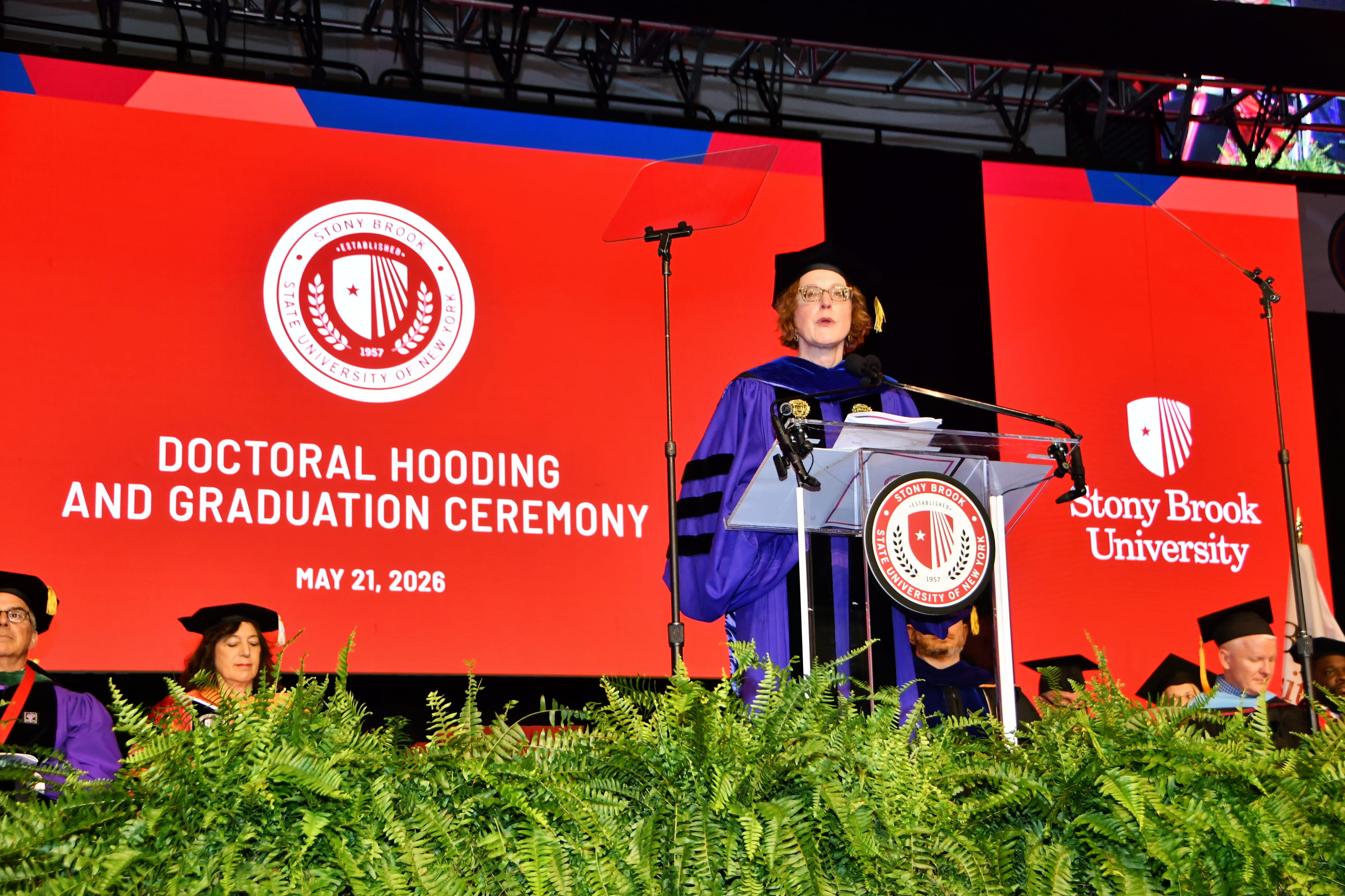 Dean speaking at Doctoral Hooding Ceremony