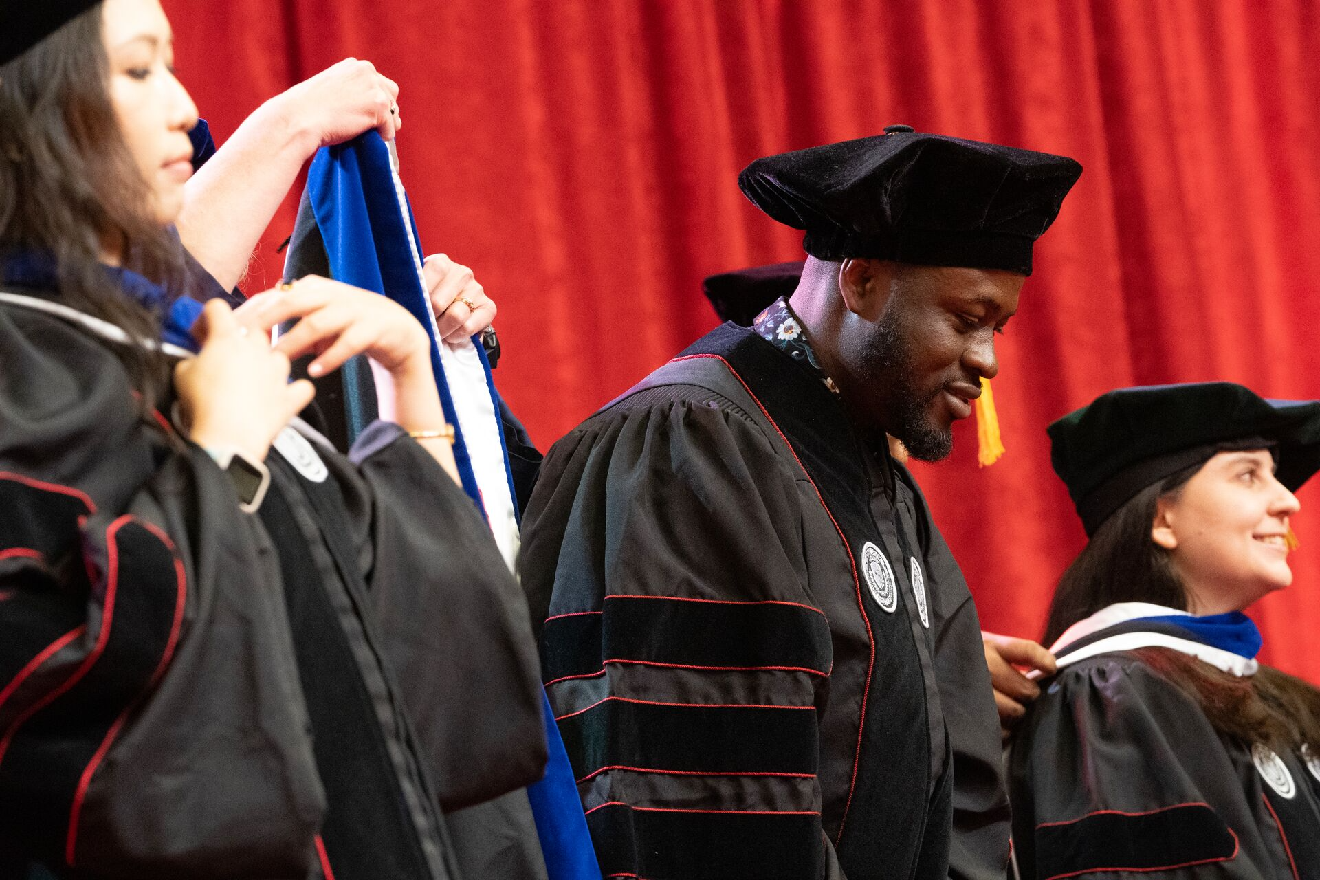 Graduates at Doctoral Hooding Ceremony