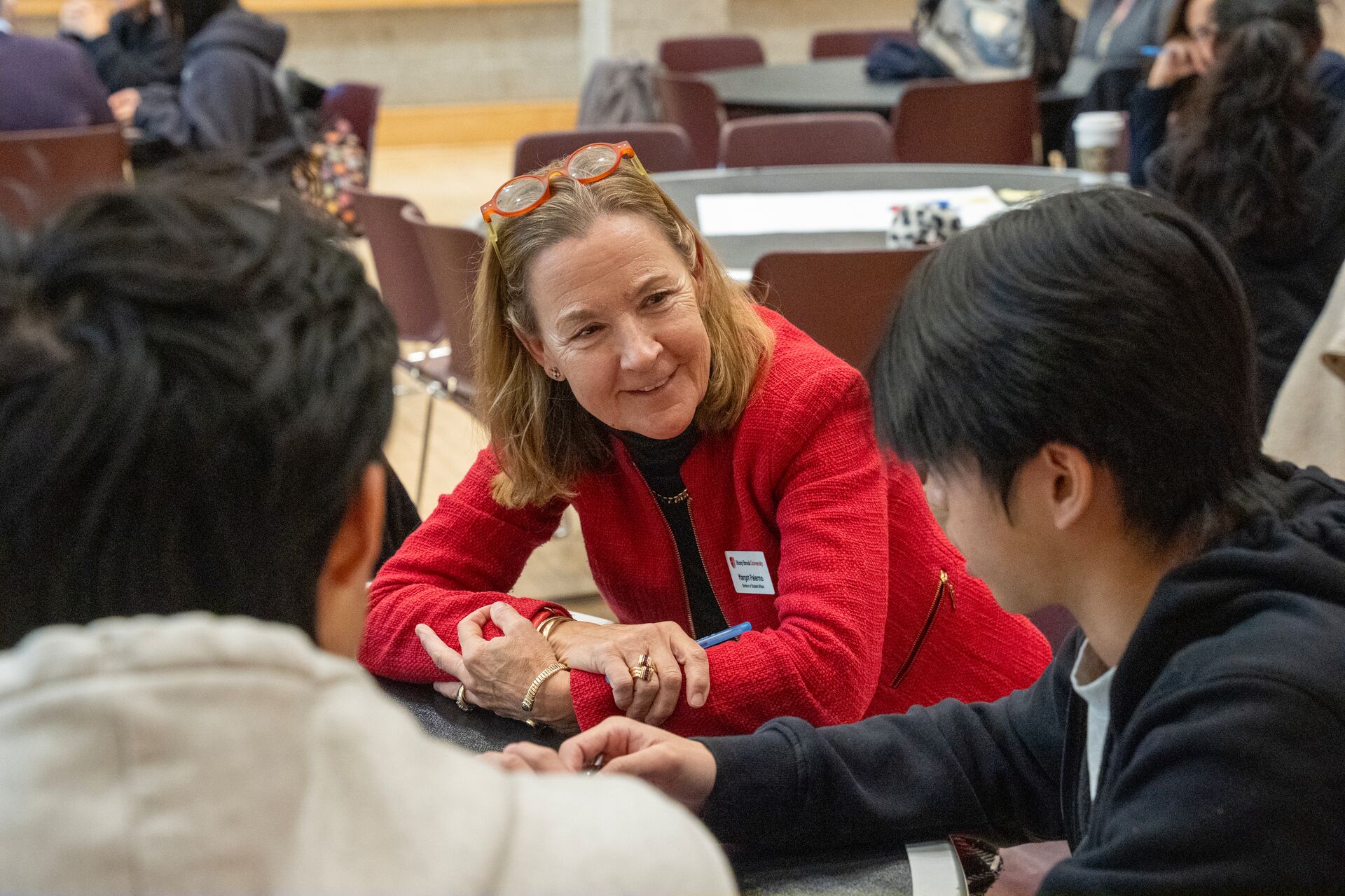 Faculty speaking with student.