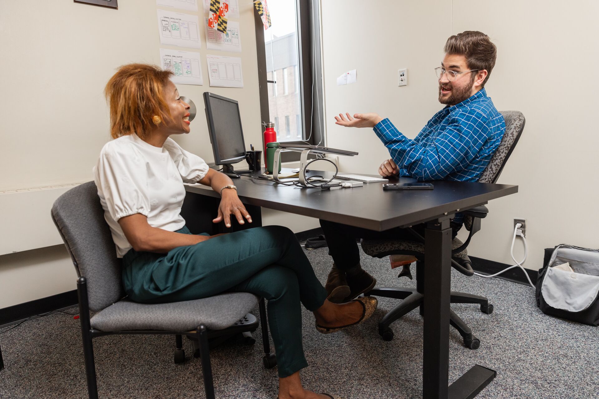 Student speaking with a faculty member