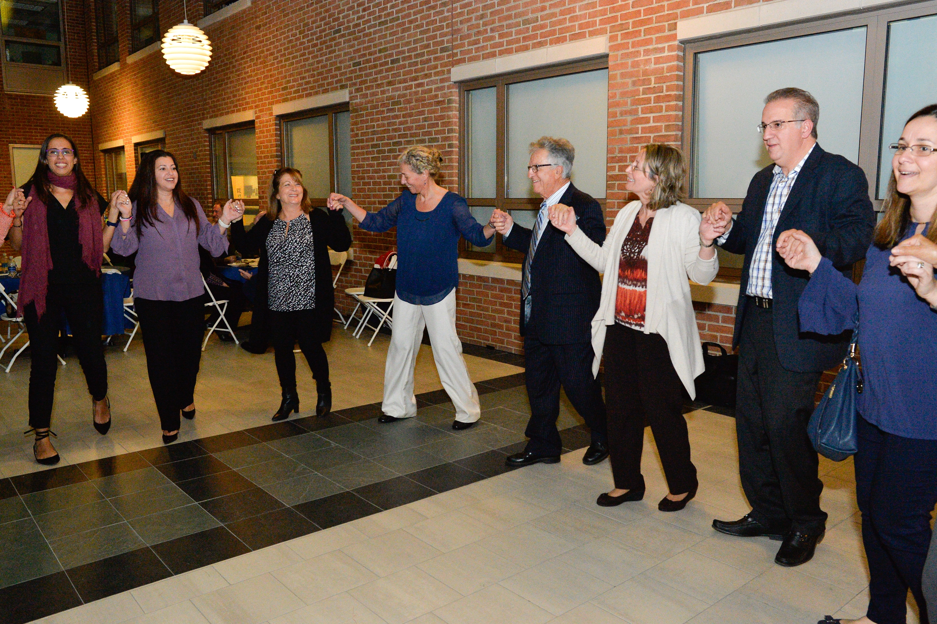 Community members dancing at the opening ceremony.