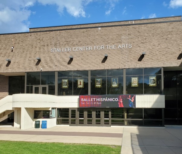 Exterior of the brick Staller Center for the Arts featuring a Ballet Hispánico banner.
