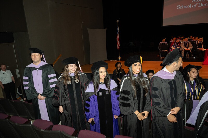 Graduate students and faculty in academic regalia