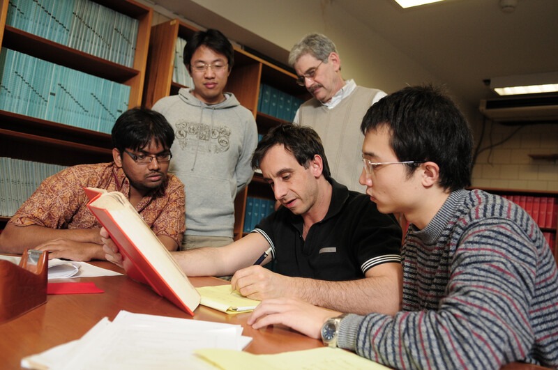 Students studying together in a research library