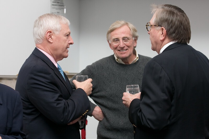 University representatives networking at a campus event
