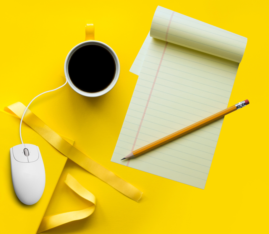 image of coffee cup, writing pad and pencil, and closed journal book