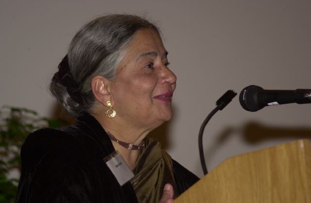 Anita Desai speaking at a podium