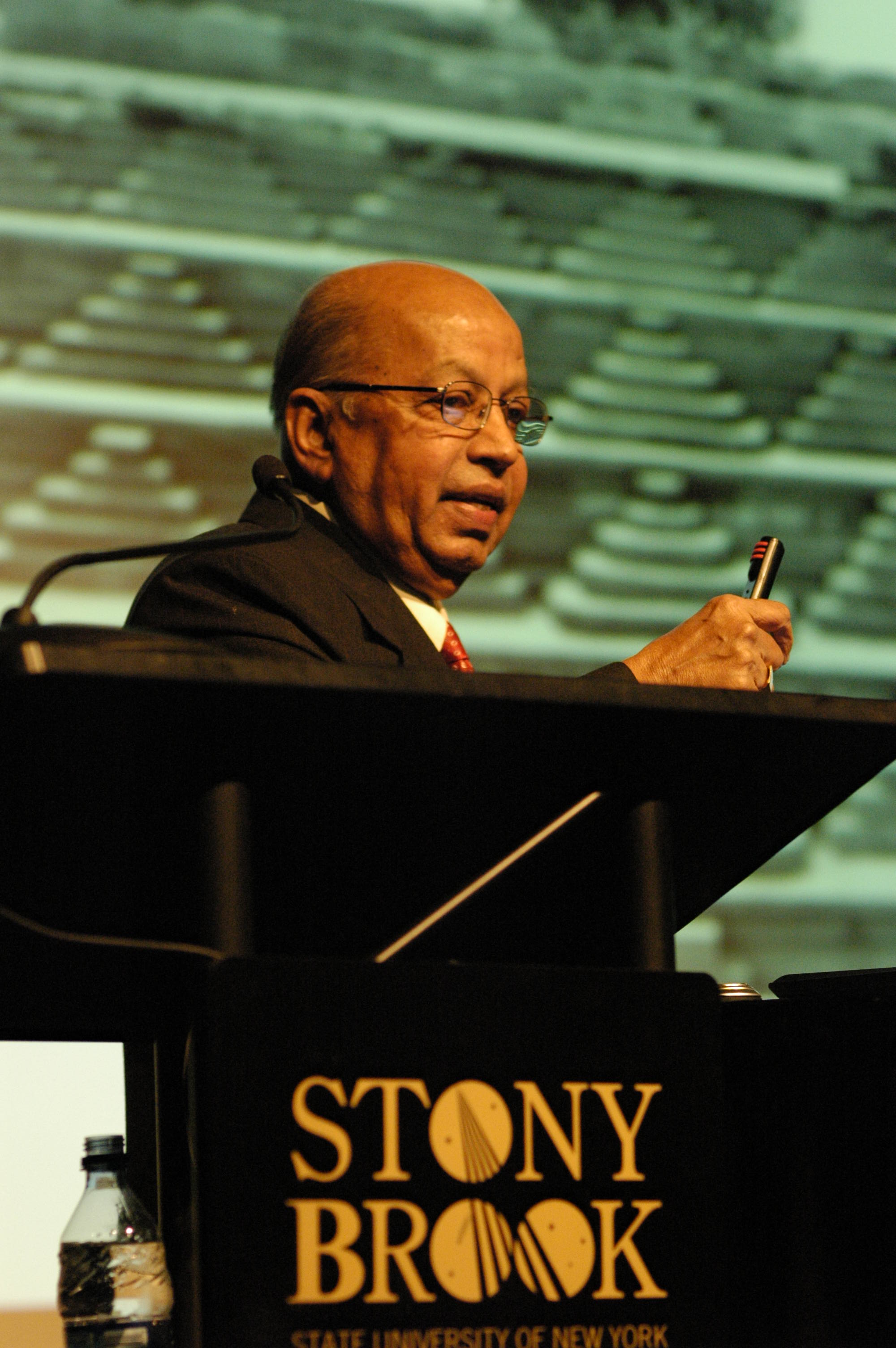 Dr. M.S. Nagaraja speaking at a podium