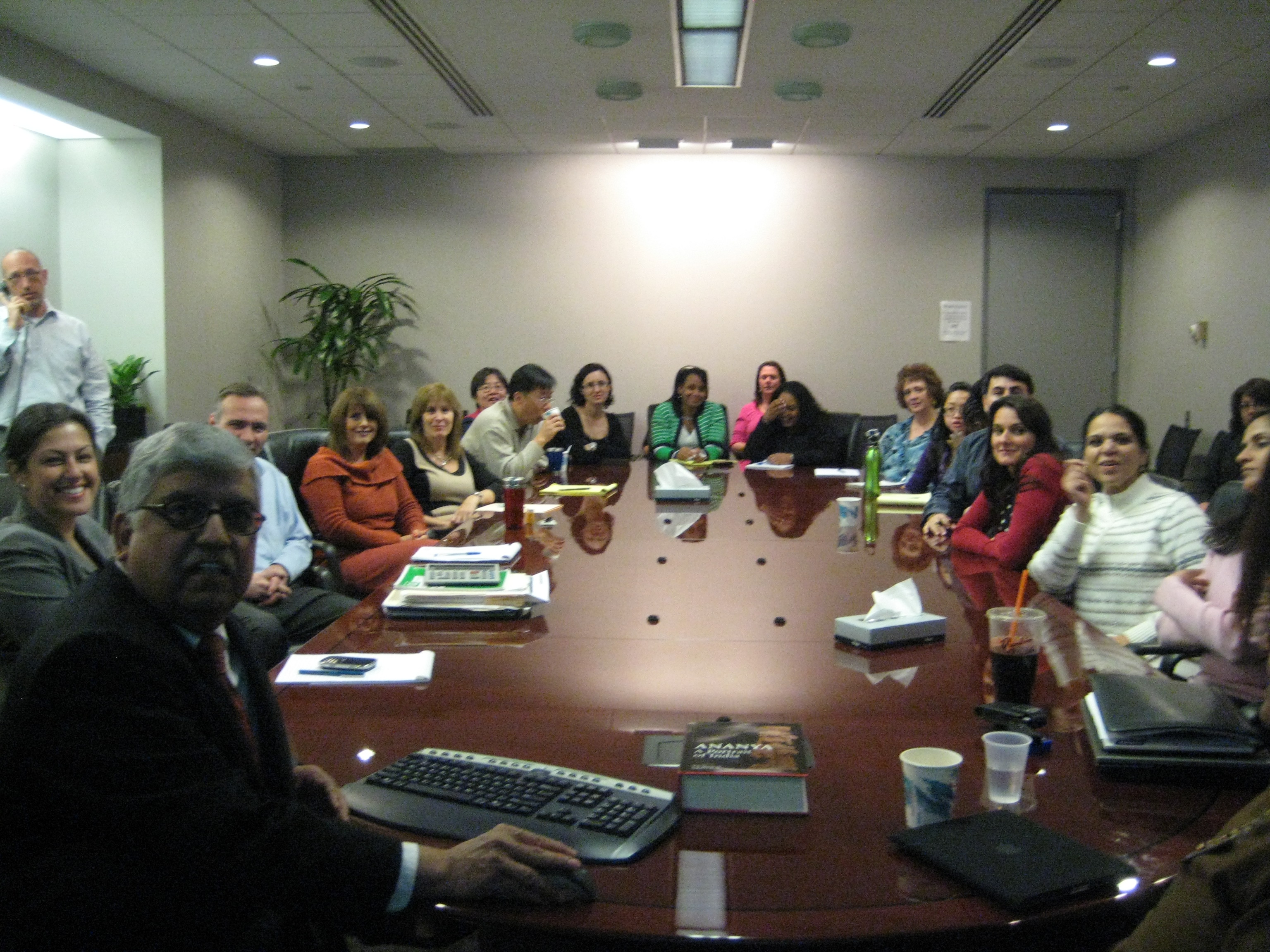 Large group of people at a conference table