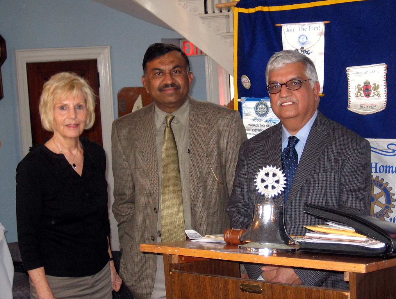 Three people smiling at the camera