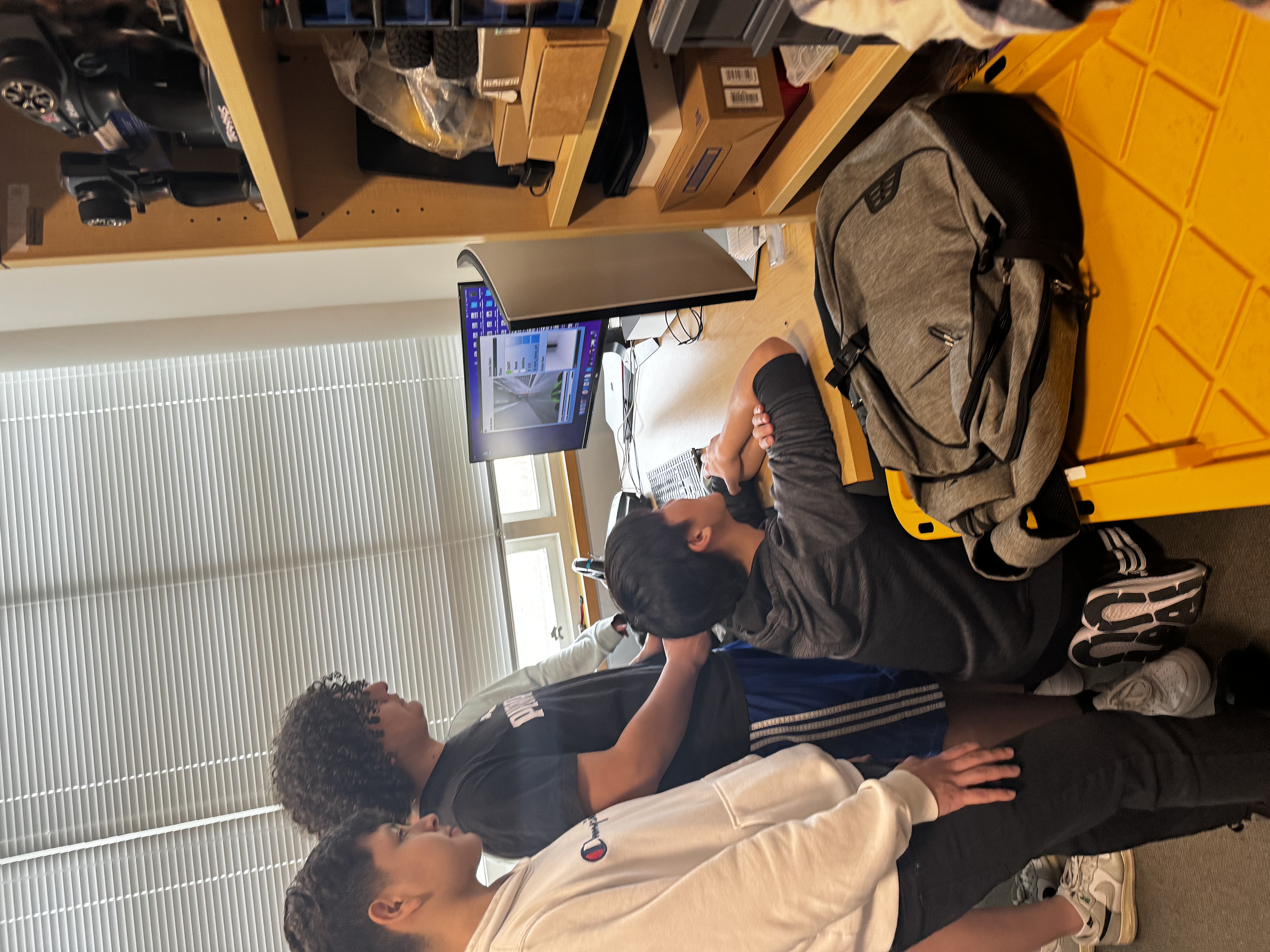 students looking at computer