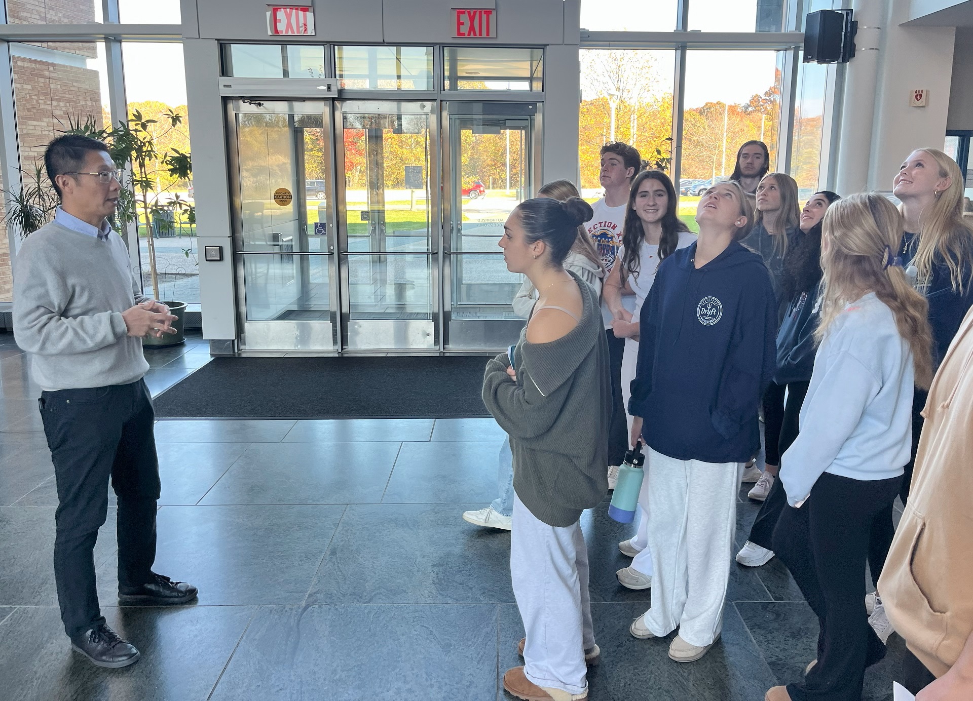 Rong Zhao with Westhampton High School students