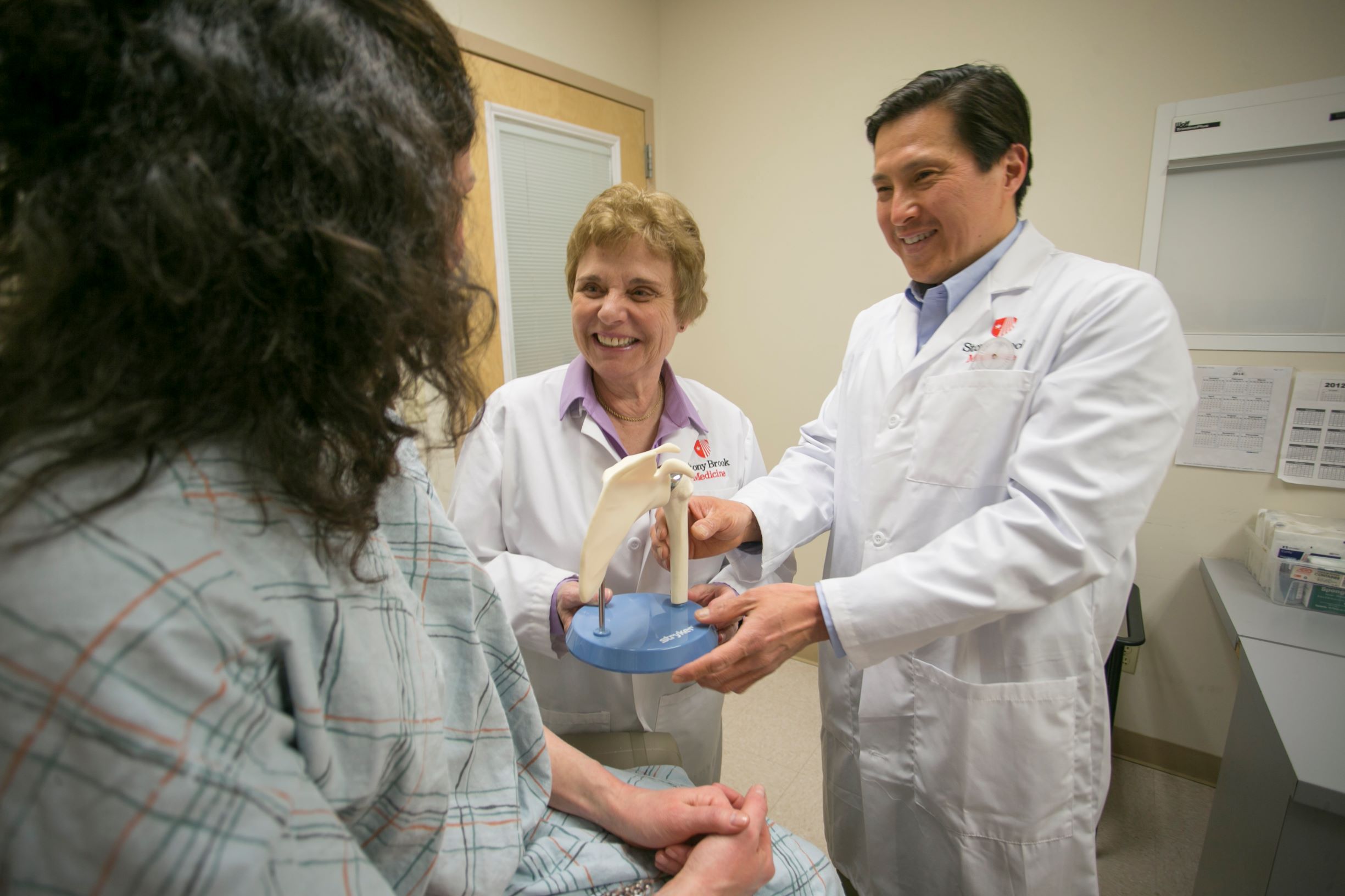 Marie Badalamente, PhD, and Edward Wang, MD with patient