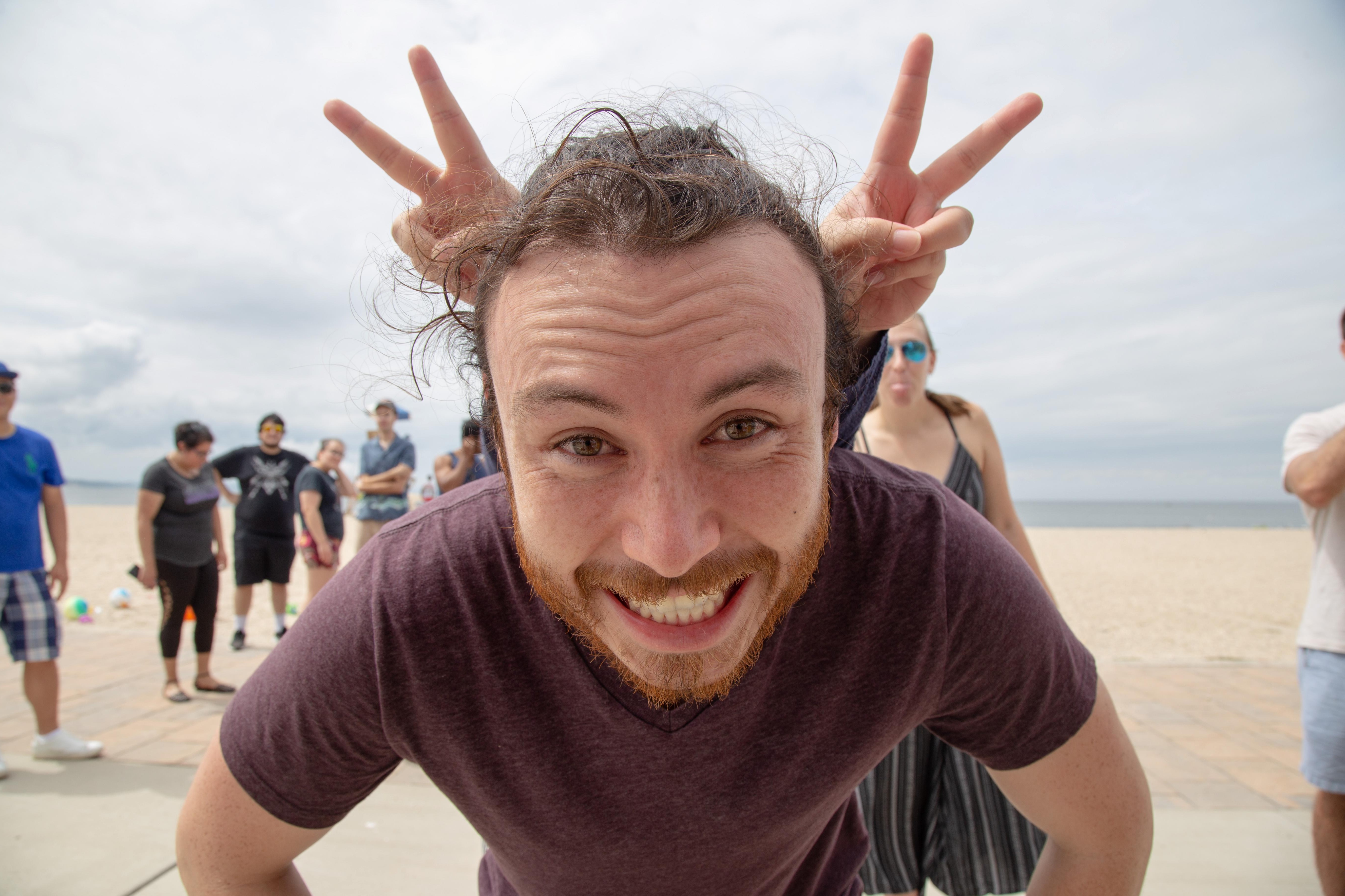 Person smiling at the beach