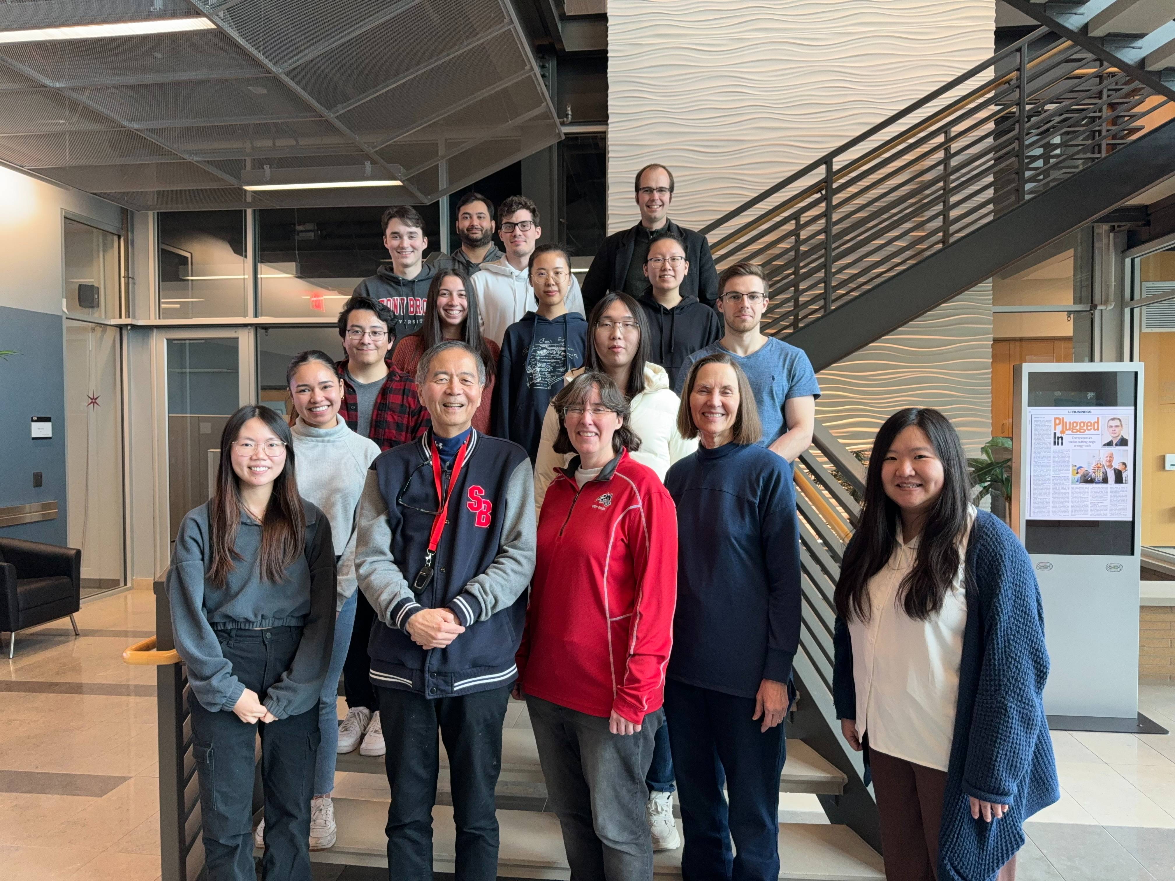 Group of people smiling in a lab building
