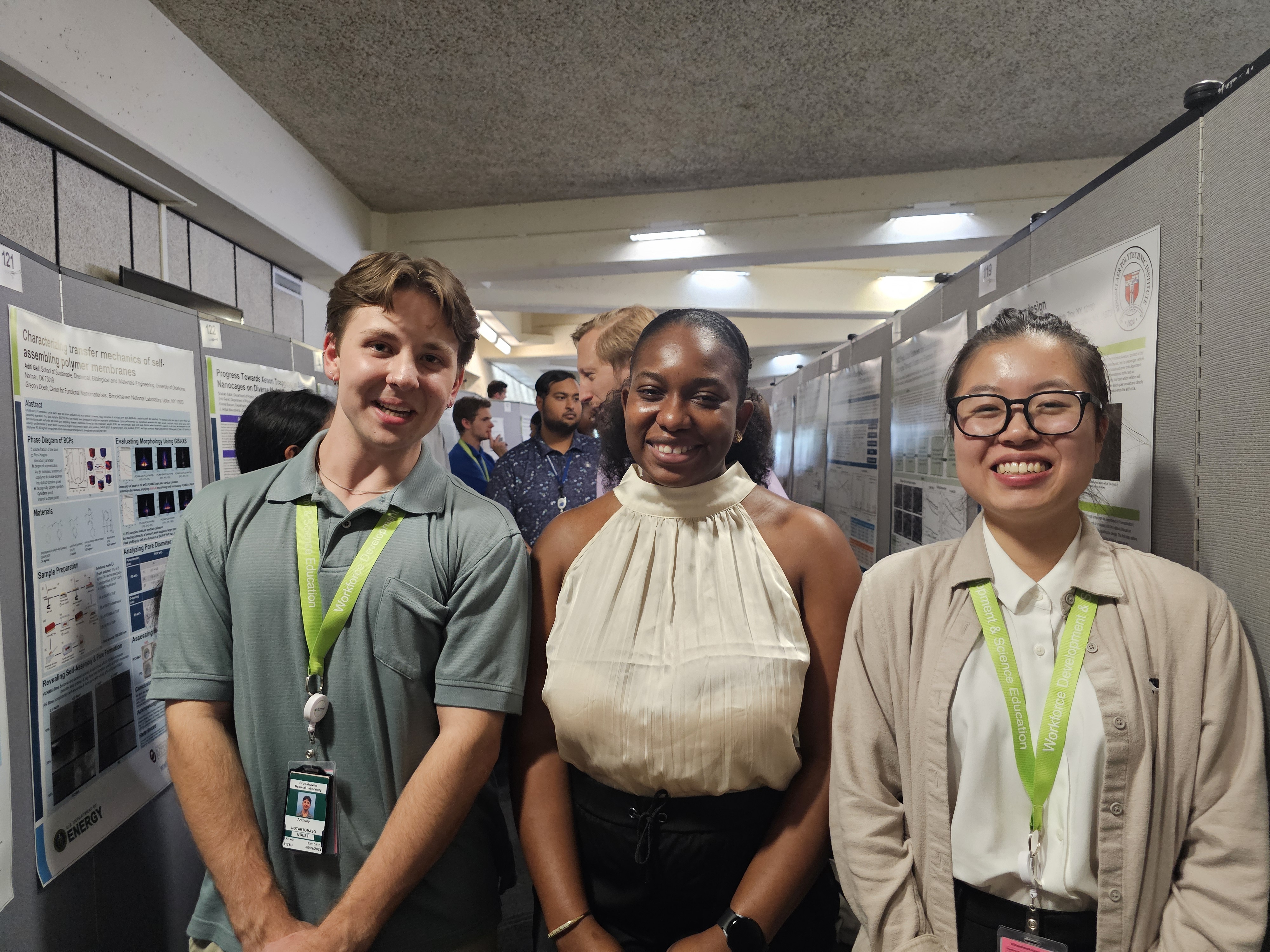 Three students smiling
