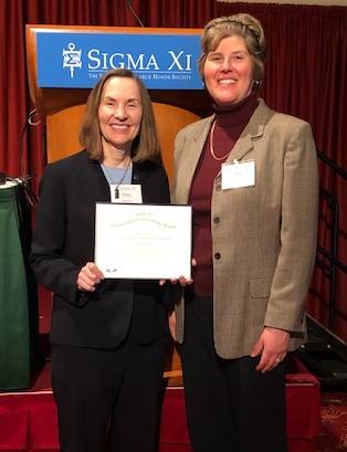 Dr. Esther Takeuchi receiving an award