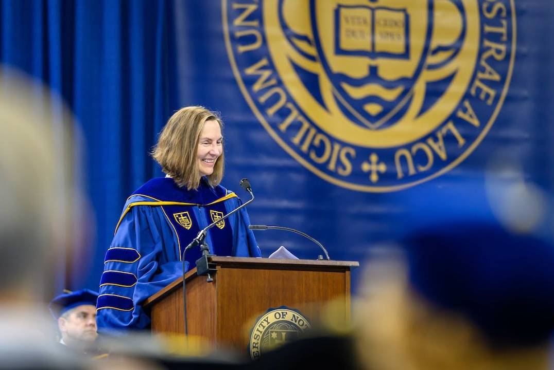 Dr. Esther Takeuchi speaking at a podium