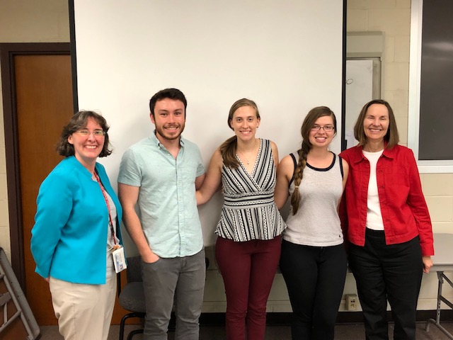 Five students smiling