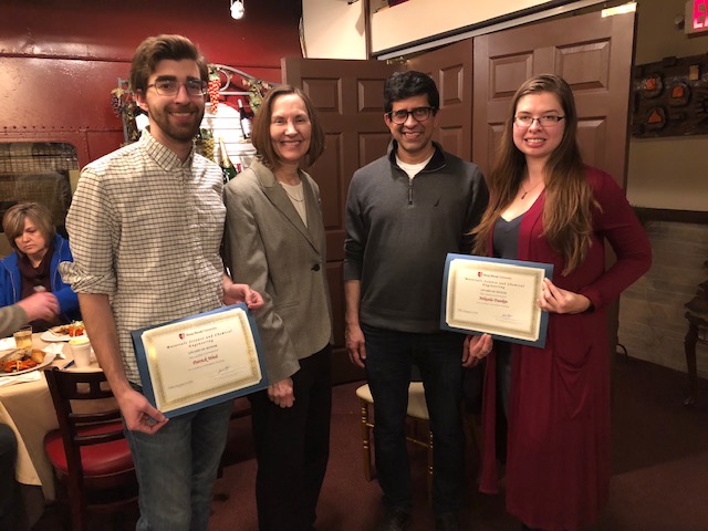 Two people receiving TA awards