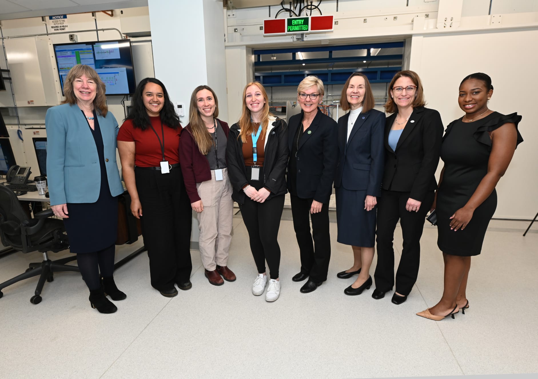 Eight women smiling for a photo