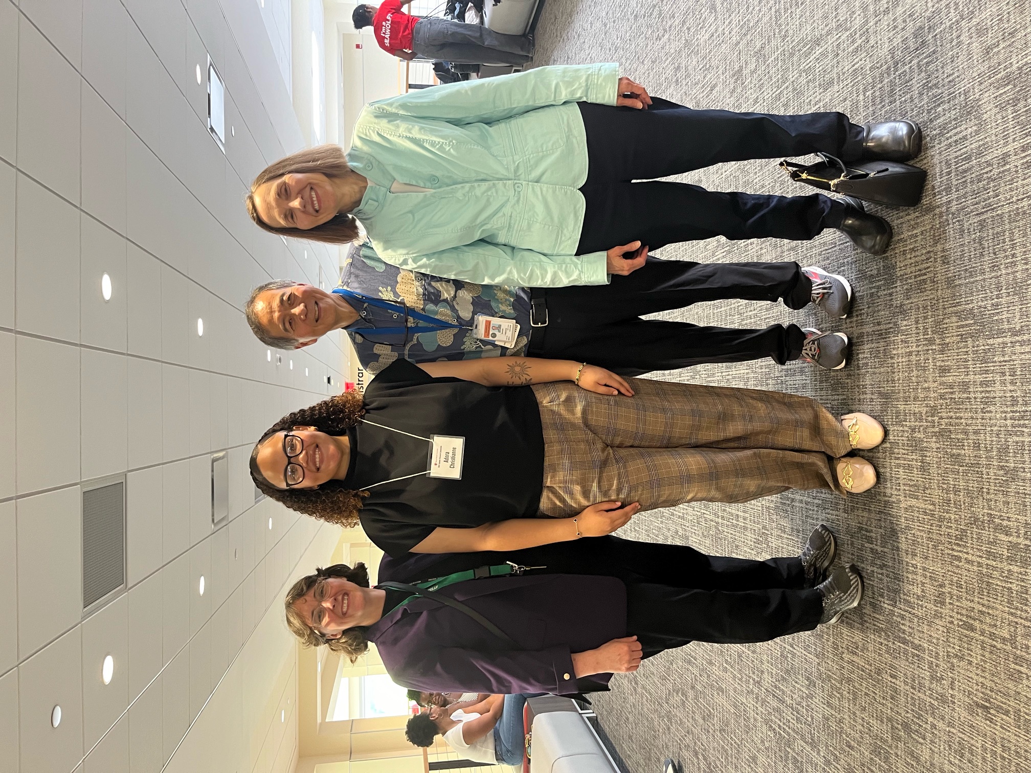 Four people smiling