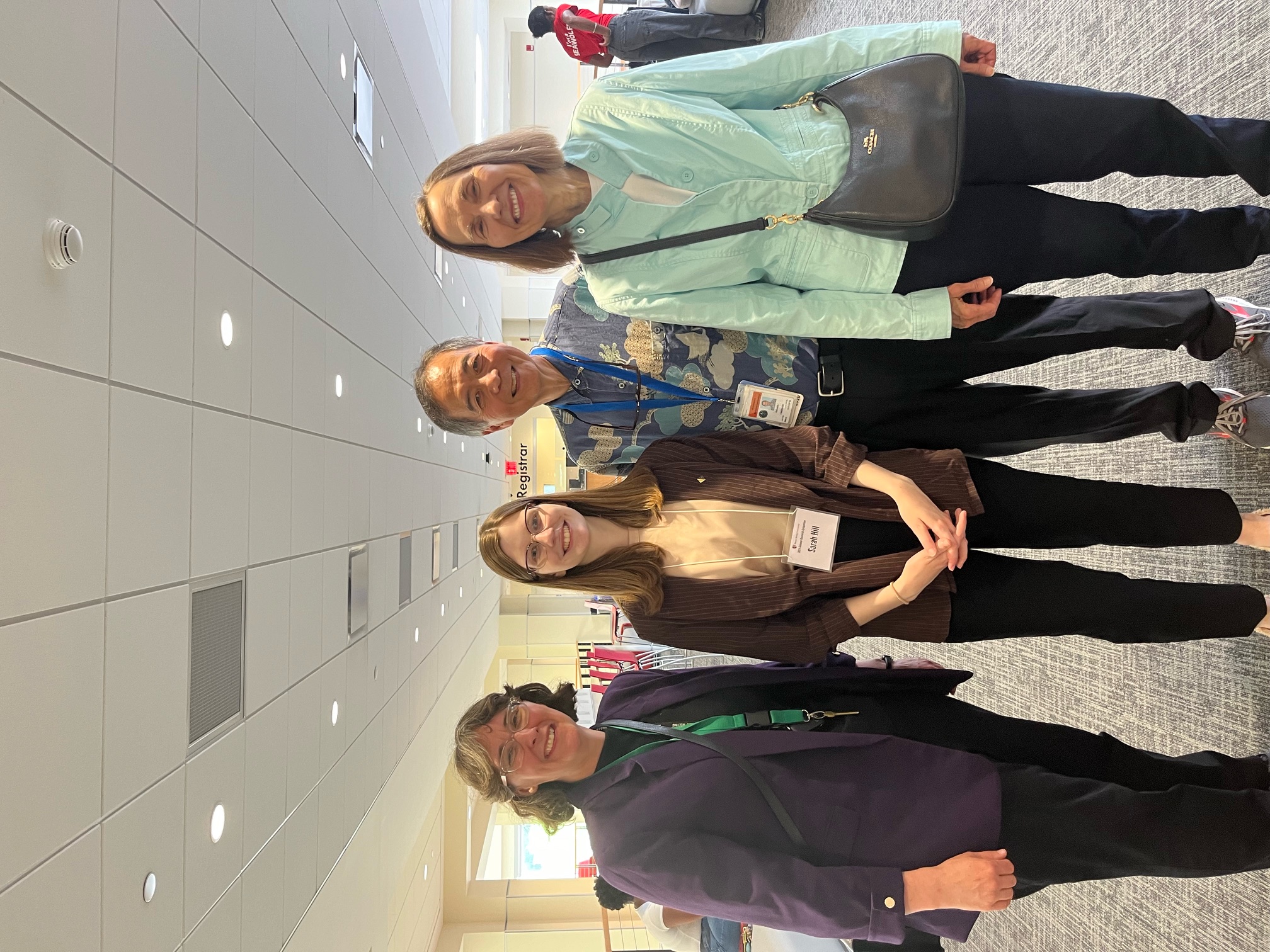 Four people with badges on