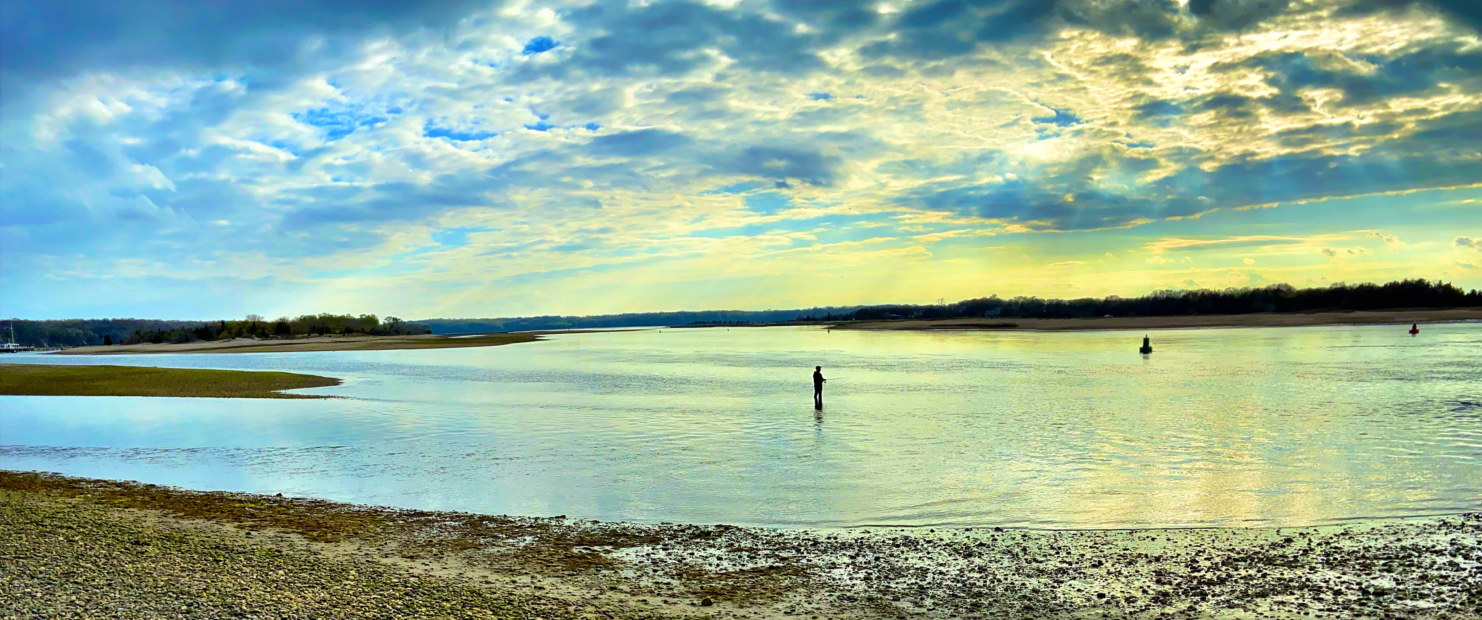 Coastal shoreline on Long Island with calm water and open sky