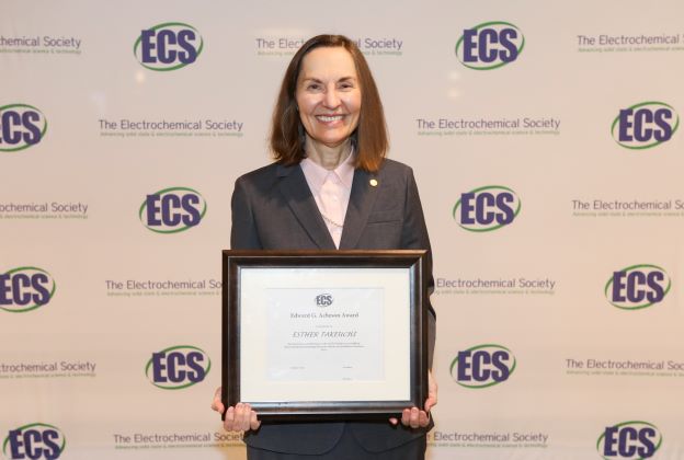 Professor holding an award