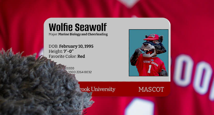 Wolfie holding his SBU ID Card