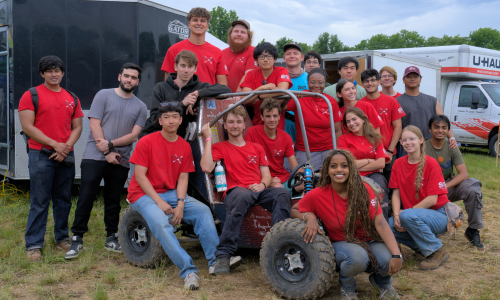 Members of the SBU Motorsports Team and Advisor, Austin Giordano, pose with Car #99