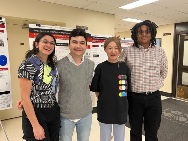 SBU Students and advisor, Leana Grotz, pose in front of a research poster