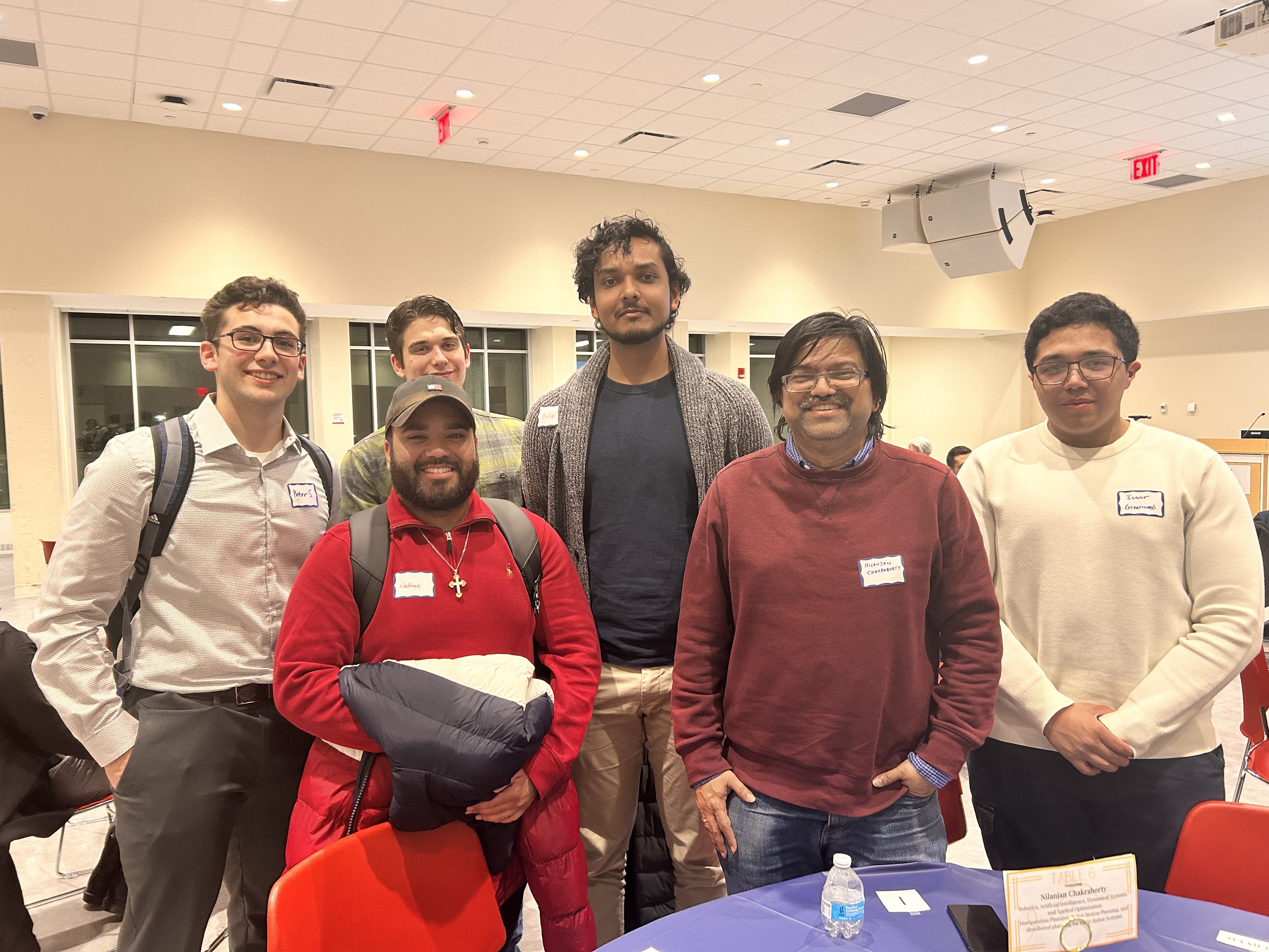 Students pose for a photo with Professor Nilanjan Chakraborty