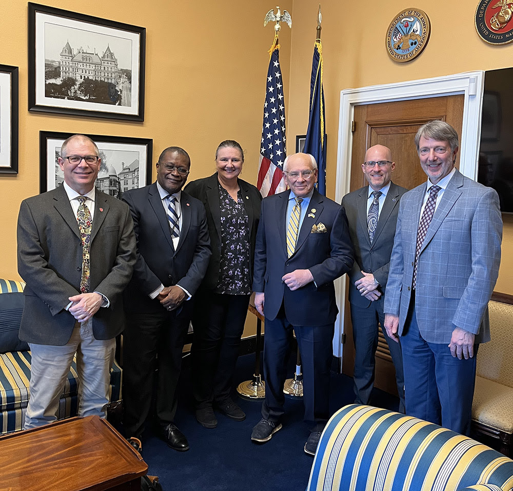 Professor Jon Longtin poses with officials on Capital Hill