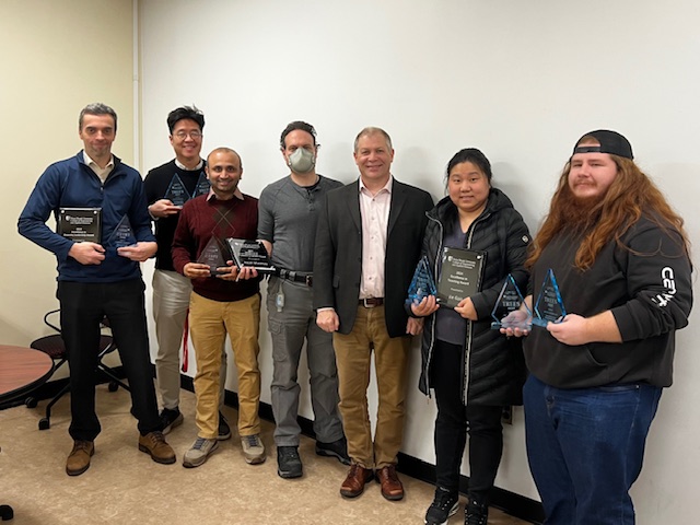 MEC Department faculty pose with their awards