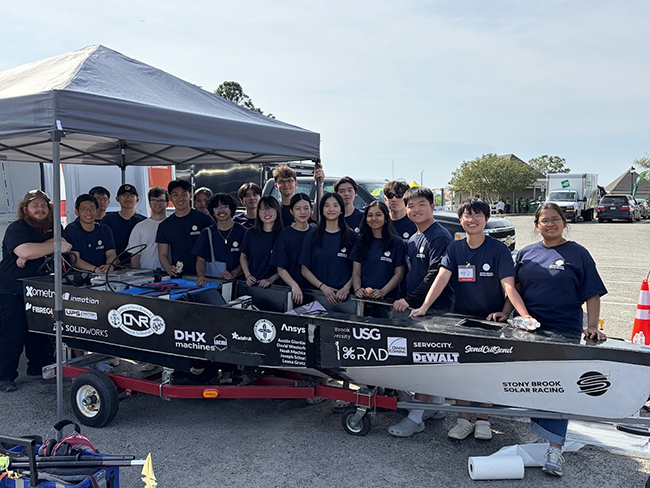 Members of the Solar Racing Team pose with their unmanned boat