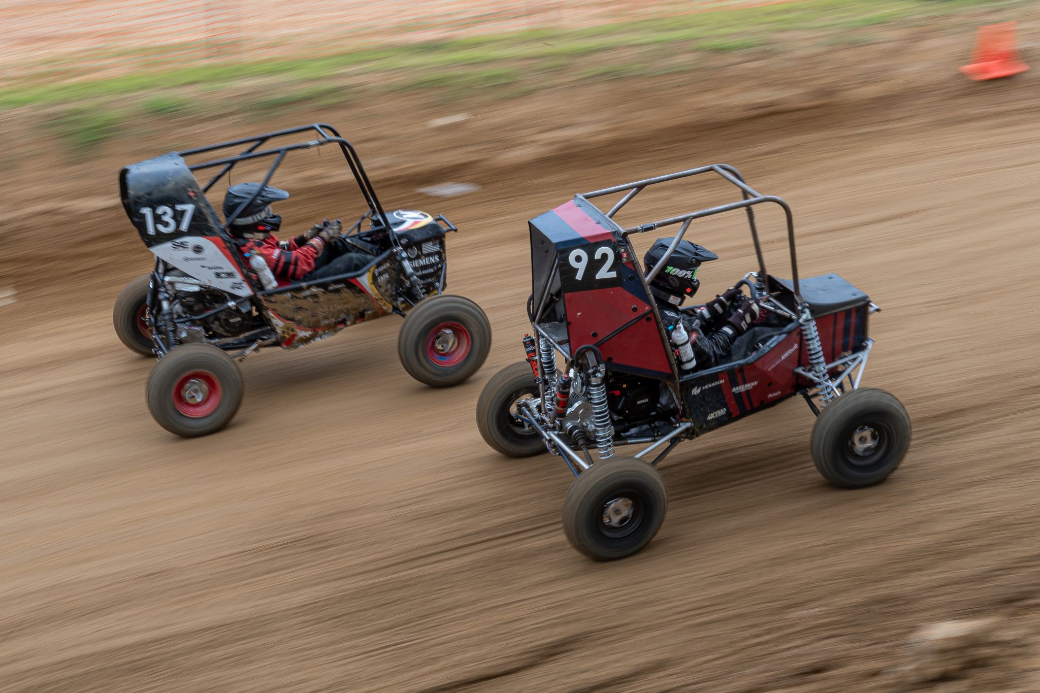 Image of two Baja cars racing