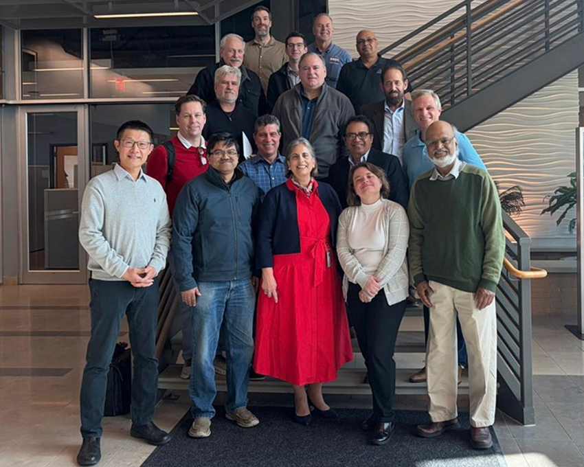 The attendees of the SBU Robotic Listening Session pose on a stairway 