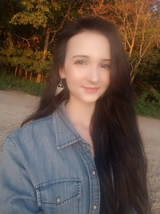 Portrait of Brianna Young with long hair and in blue denim shirt