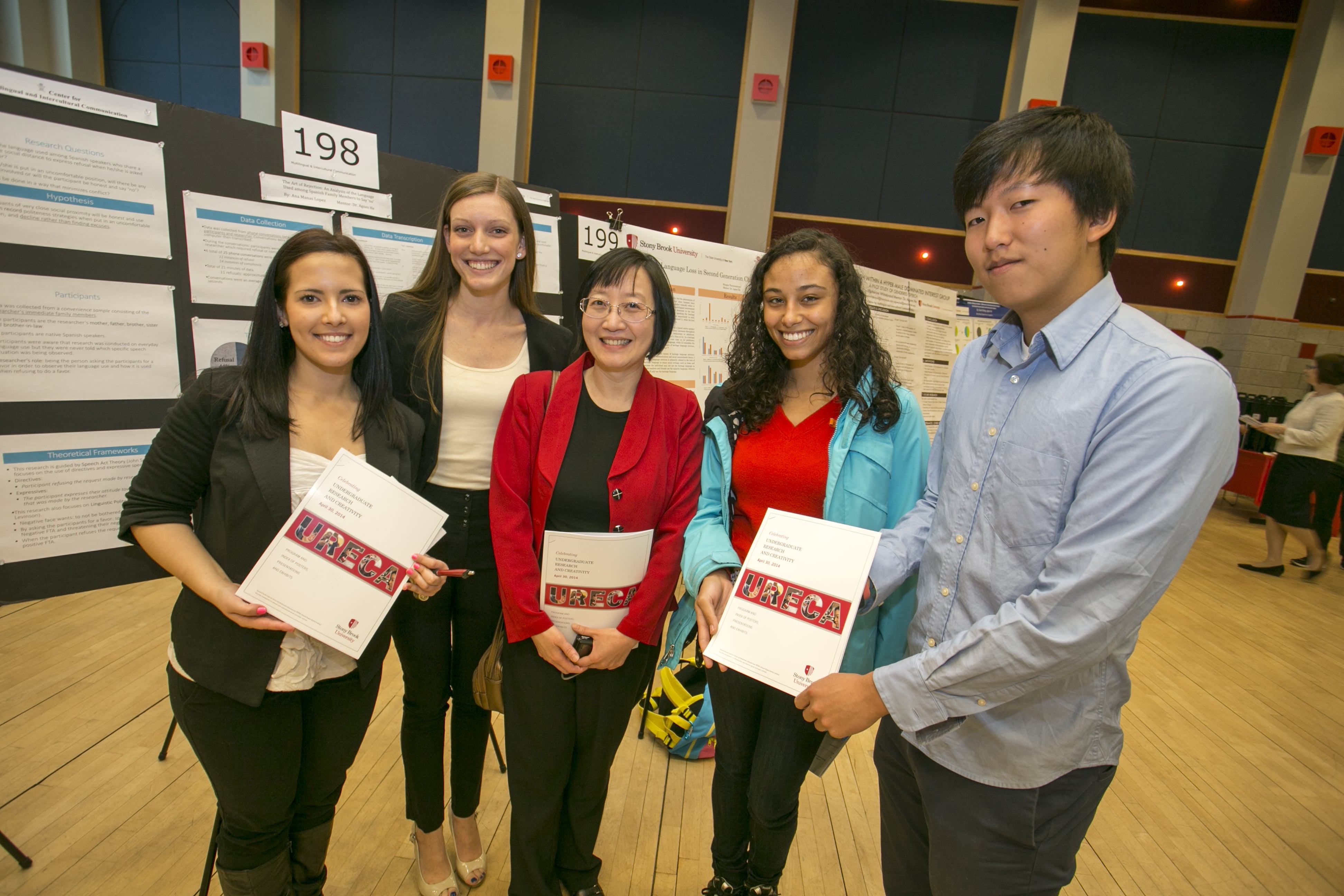 Undergraduate student presenters standing with Dr. Agnes He at annual 2014 URECA