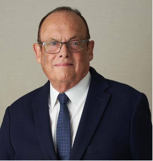 Kingsley bolton headshot, person with glasses in suit