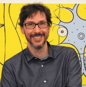 Headshot of Alfredo Fontanini standing in front of a yellow painting