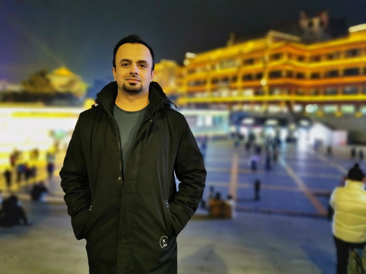 Javed Iqbal with cityscape in background